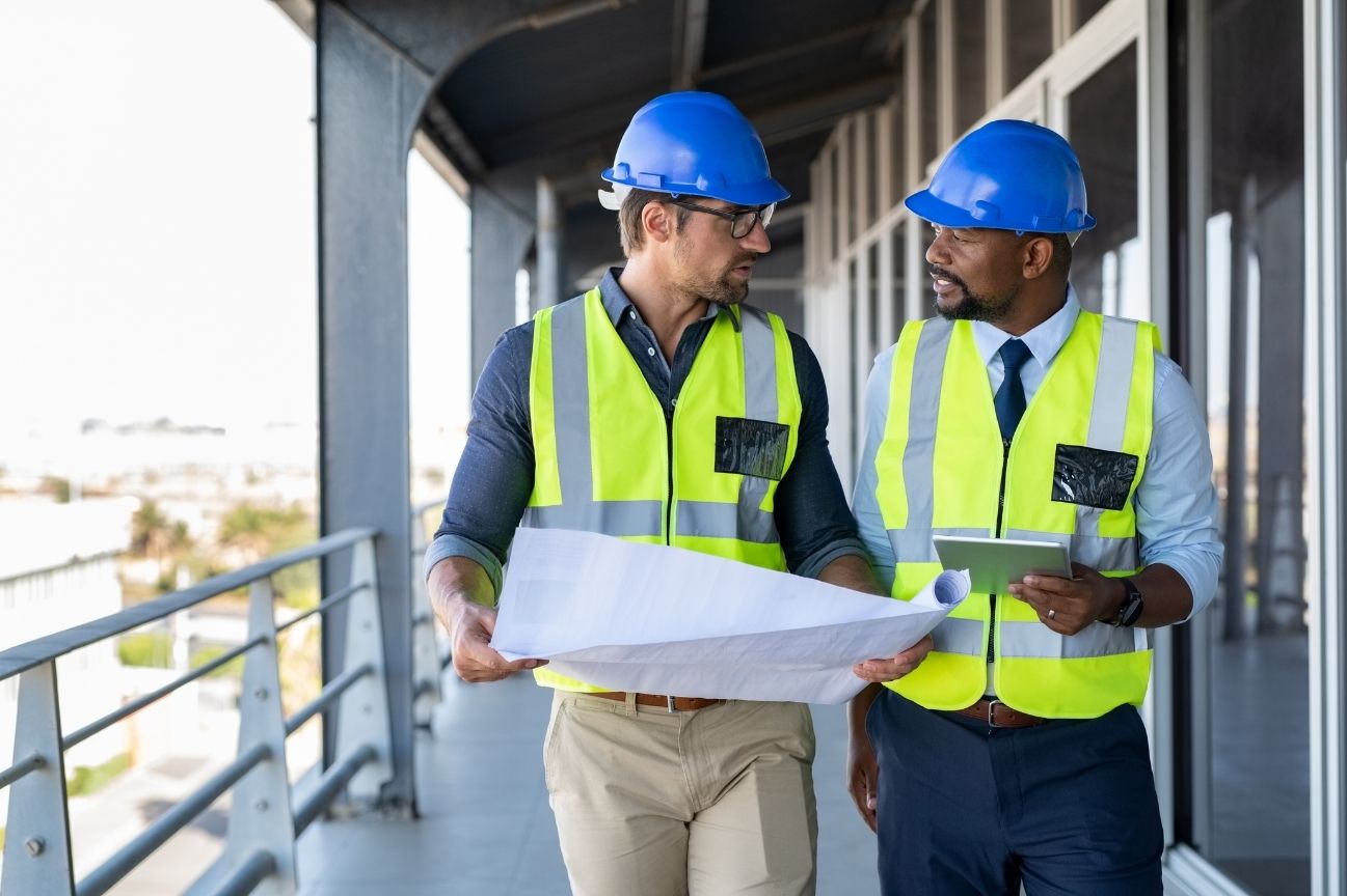 Architects discussing the BIM to digital twin process on site