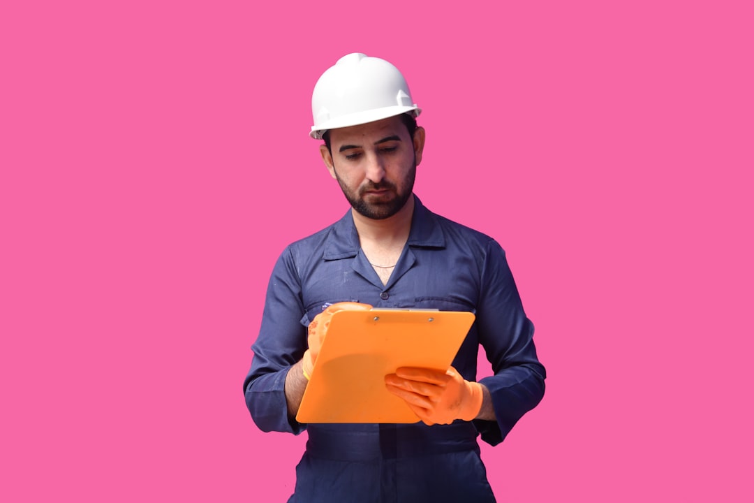 Facilities manager using a digital dashboard connected to a BIM-derived asset database